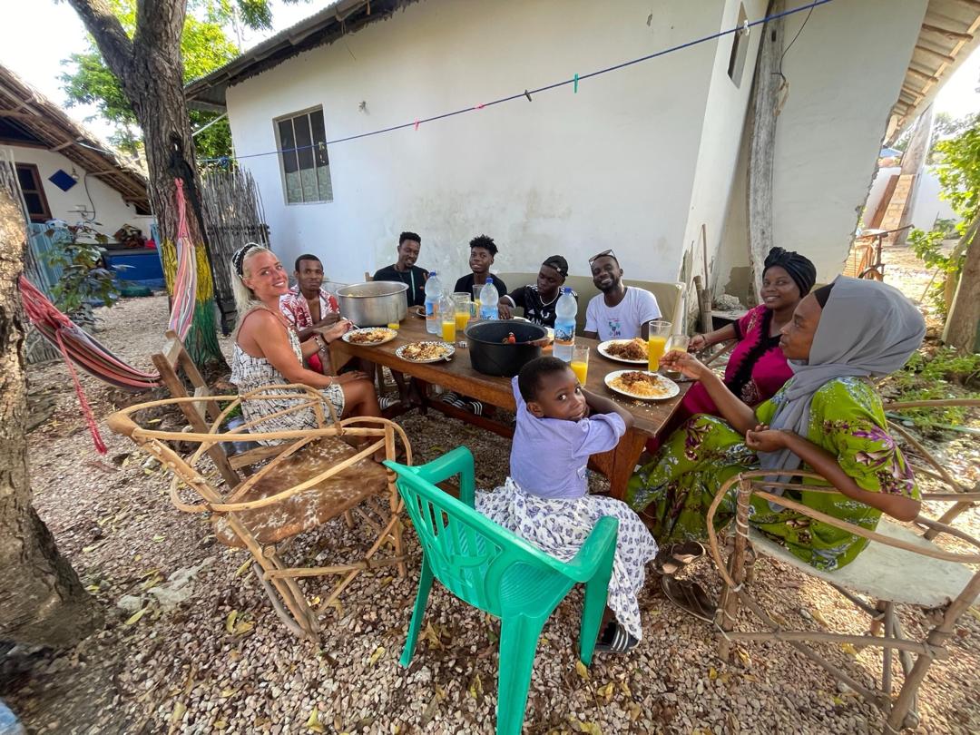 Sharing food at the family compound in Jambiani